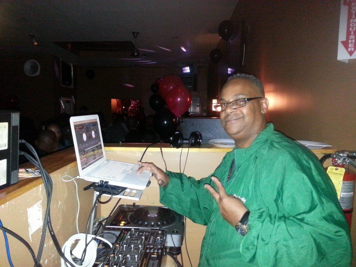 DJ Dr Arn Jay spinning at a party with balloons